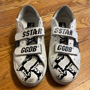 Golden Goose Old School with snake-print detailing and golden heel counters.